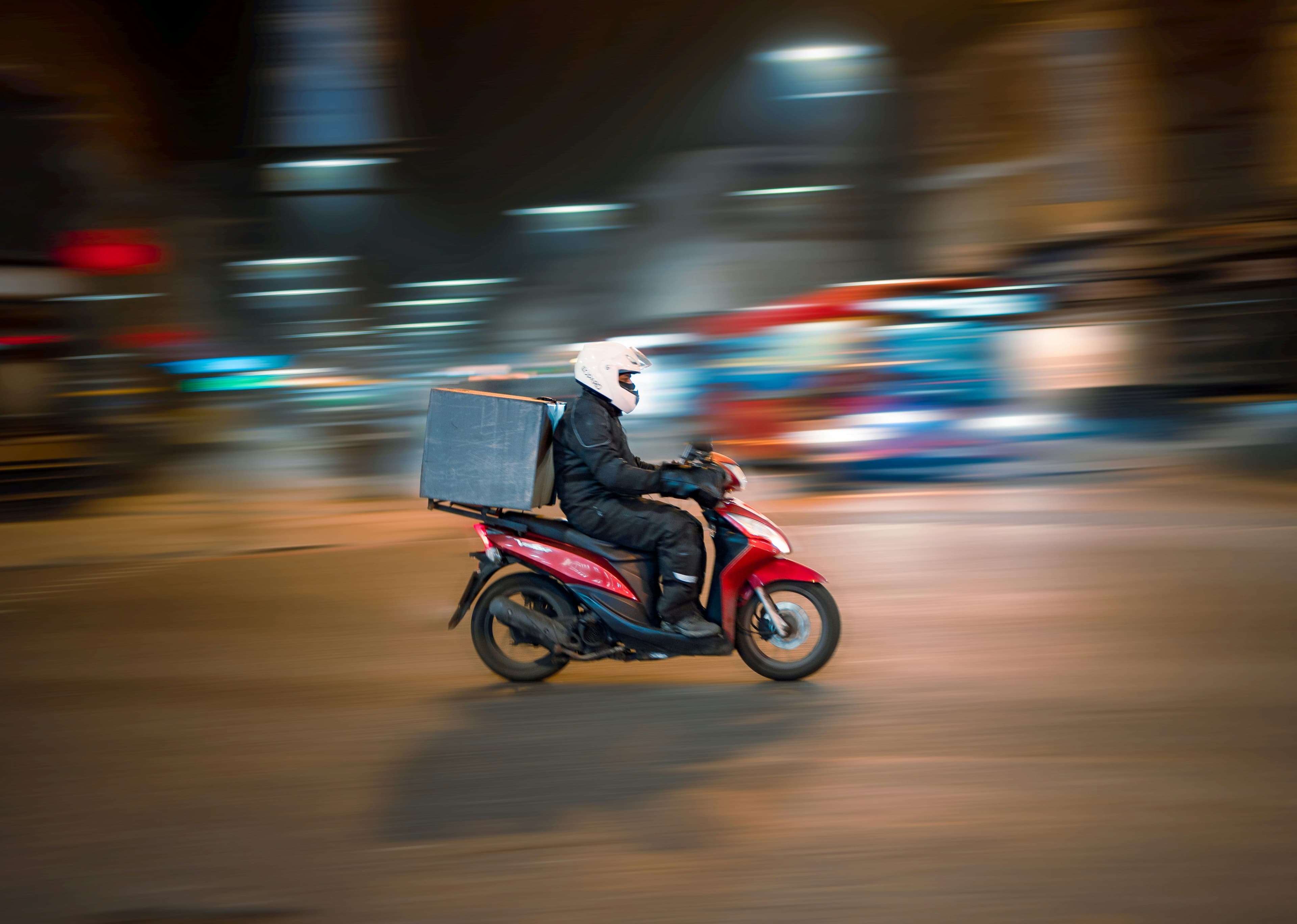 Delivery courier on motorcycle