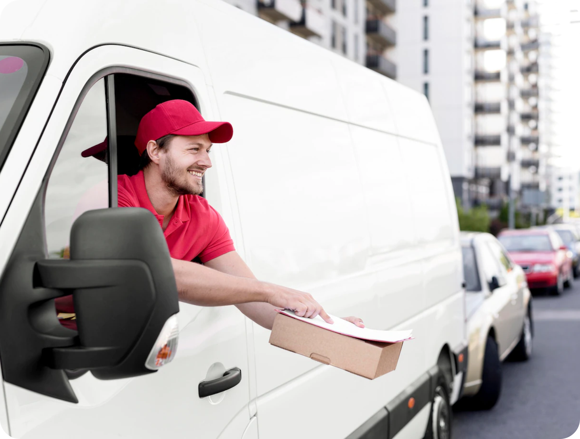 Delivery man smiling in a van